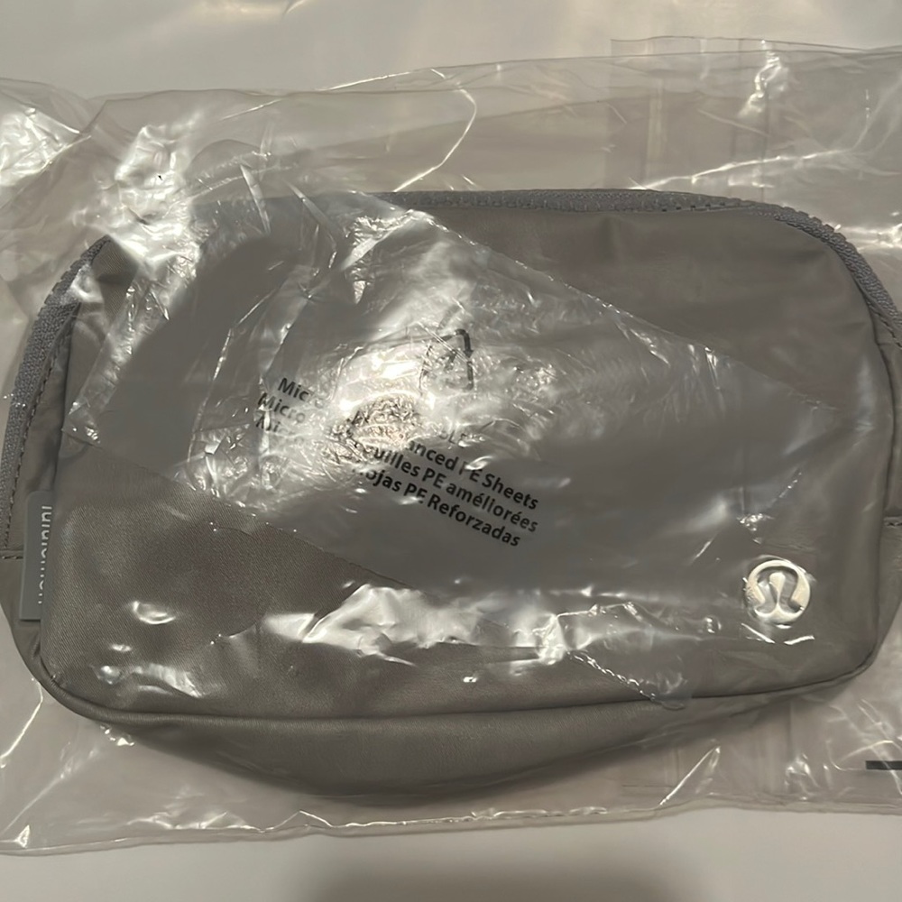 NWT lululemon belt bag silver with white letters still in packaging